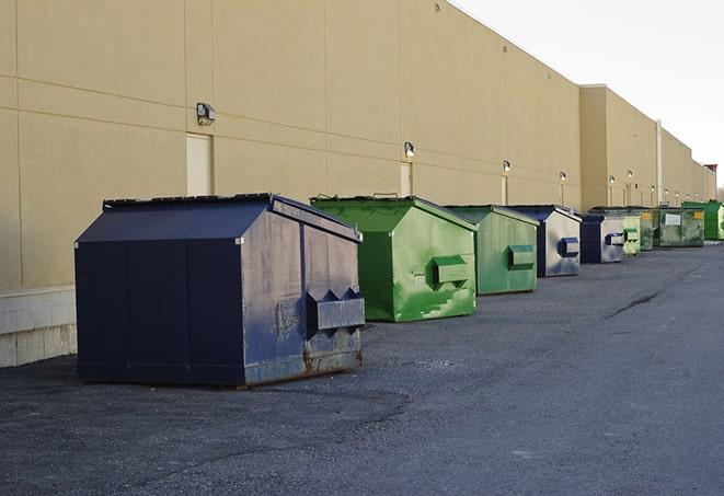 a crowd of dumpsters of all colors and sizes at a construction site in Cardiff By The Sea CA